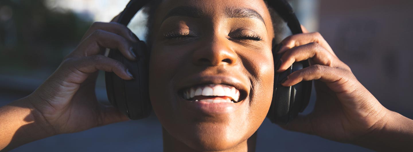 black woman with headphones